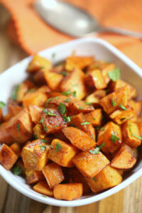 The potatoes are dusted with cinnamon and other spices then coated in a sweet brown sugar mixture and roasted to golden perfection.   This is one of the easiest roasted sweet potato recipes I have ever made.