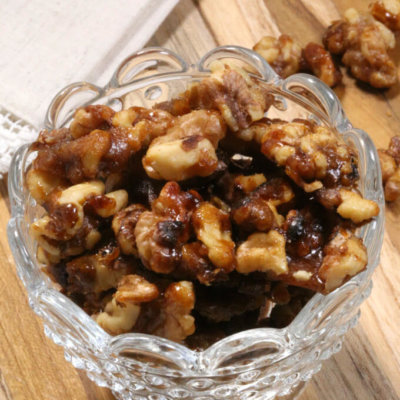 Made with walnuts, sugar, butter & cinnamon, these easy Candied Walnuts take a few minutes to make.  They're so good, you'll want want to make a few batches.