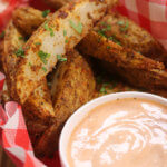 This Crispy Potato Wedges recipe is the perfect parter for burgers. They are made in the oven and oozing with flavor.