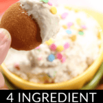 A person dipping a cookie into a bowl of funfetti dip garnished with colorful sprinkles.