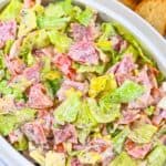 Italian Hoagie Dip in a white bowl with bread slices.