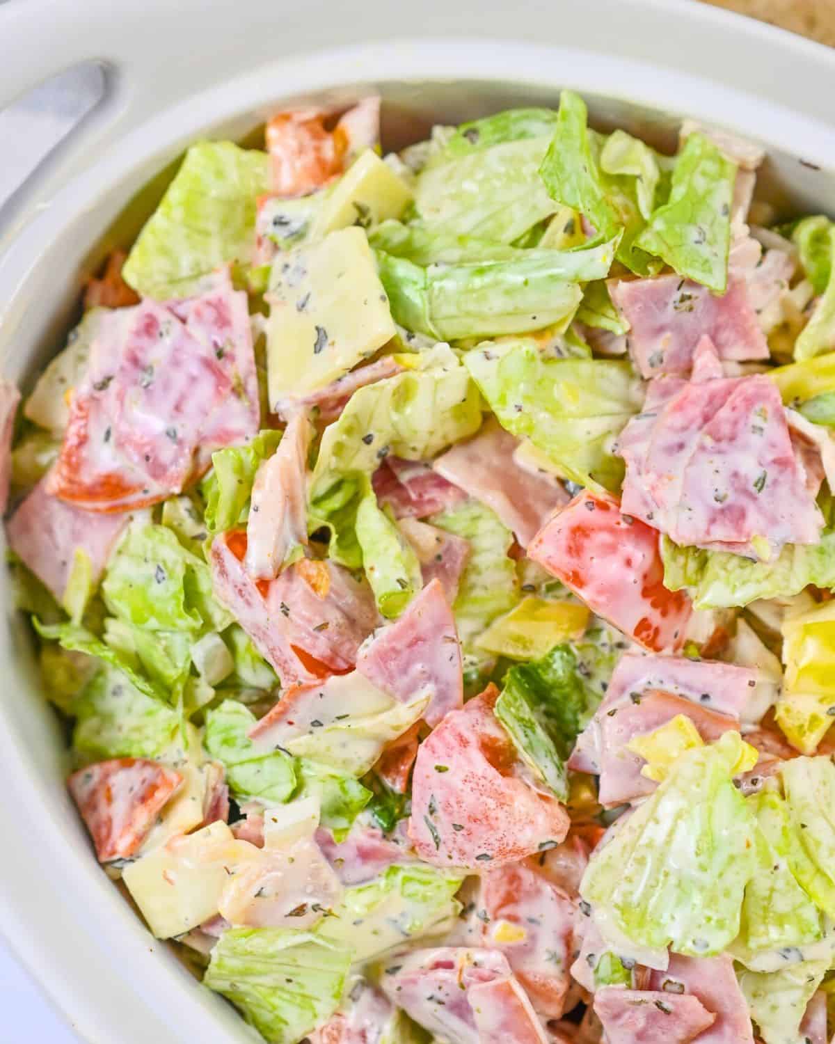 Italian hoagie dip in a white bowl.