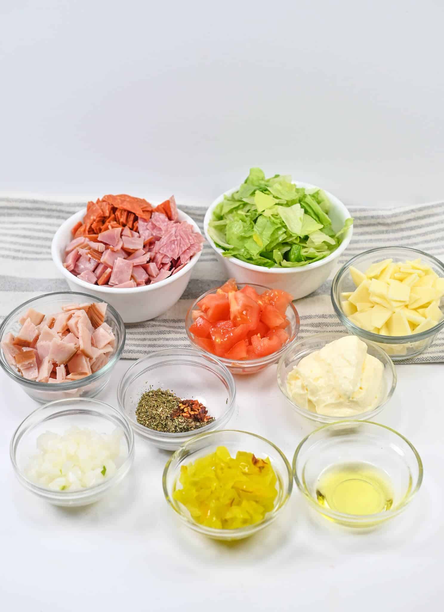 Meat, cheese, lettuce tomatoes and peppers.