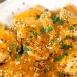 Instant Pot Bone In Chicken Thighs with Peri Peri Sauce on a white plate.