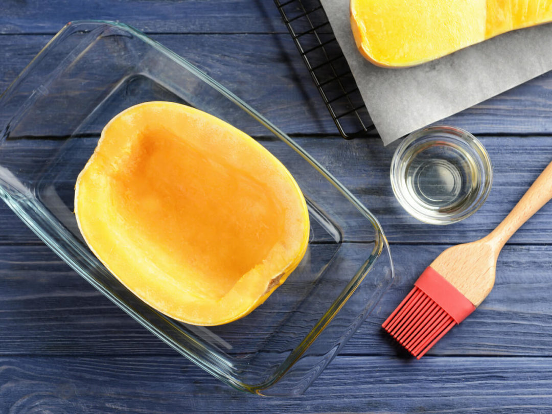 Squash in a glass dish, with a brush
