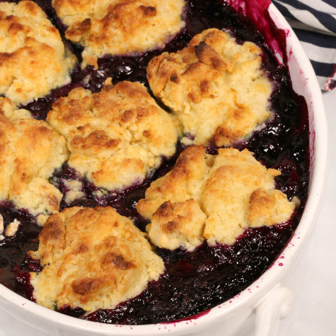 Blueberry Cobbler in a white dish.