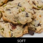 A close-up of several soft zucchini cookies with chocolate chips and nuts on a white plate. Text reads: "Soft Zucchini Cookies—Grandma’s Famous Recipe.”.