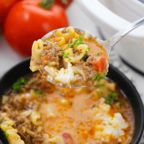 Savor a hearty bowl of One Pot Lasagna Soup brimming with meat and tomatoes.