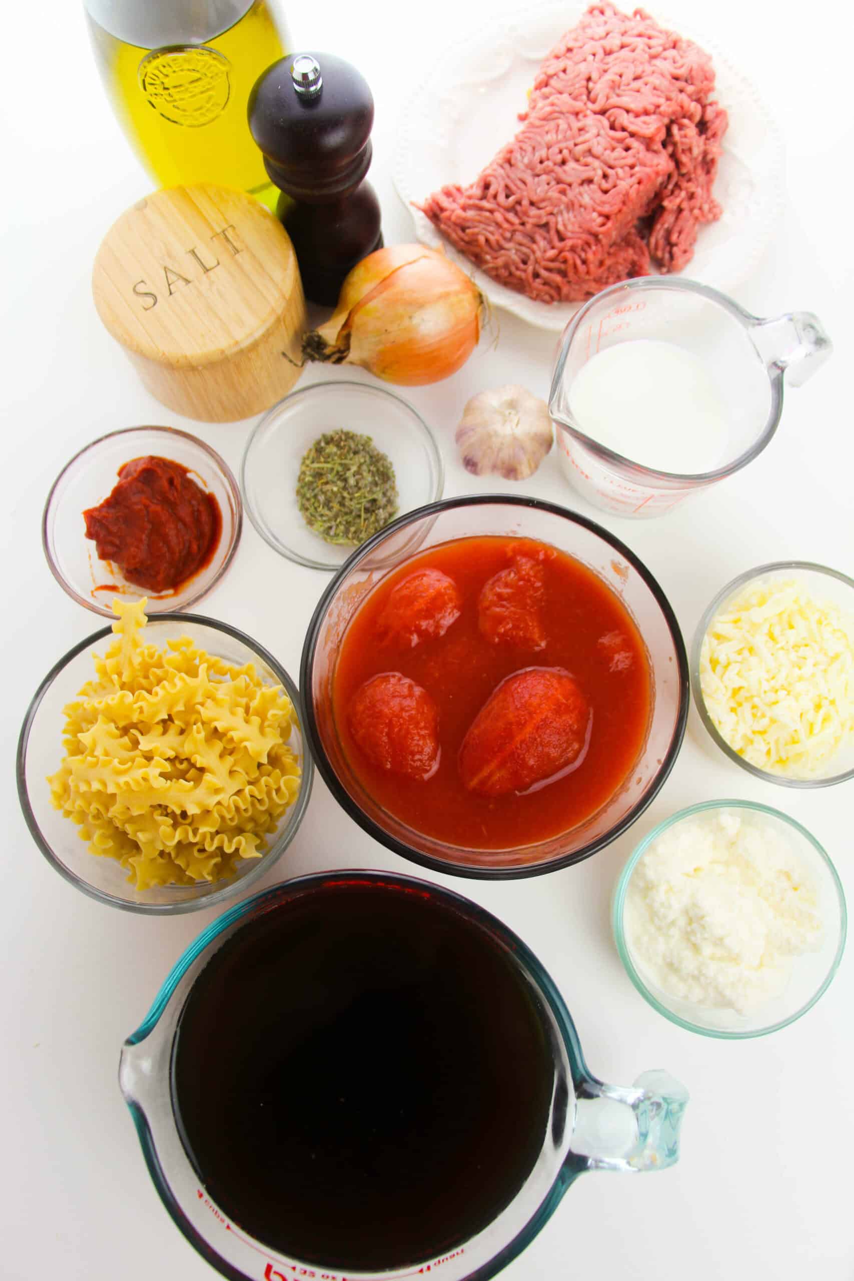Pasta, beef, tomatoes and broth to make the soup.