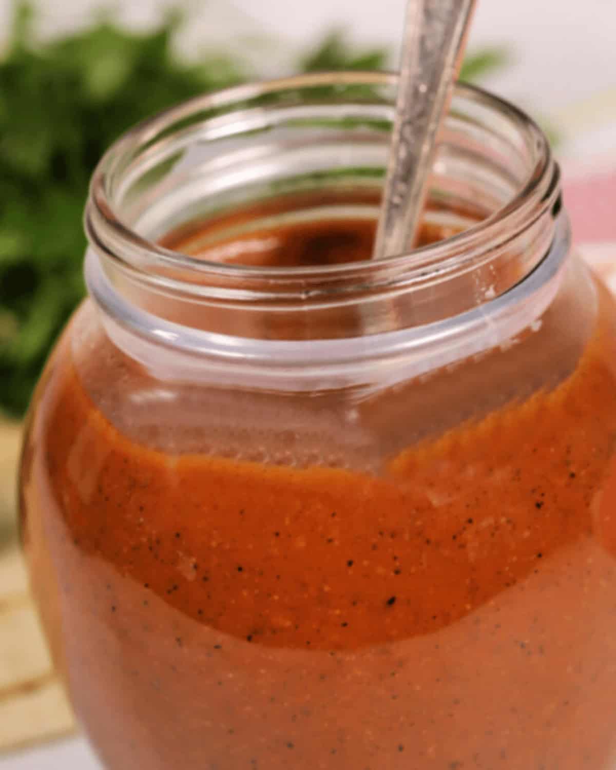 A jar of homemade r chicken enchilada red sauce.