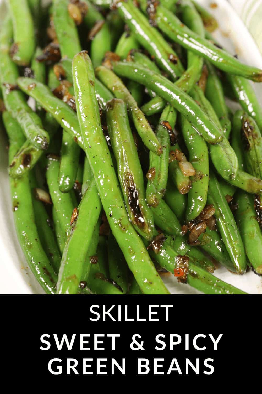 Close-up of Spicy Green Beans skillet-cooked with caramelized onions, labeled "Skillet Sweet & Spicy Green Beans.