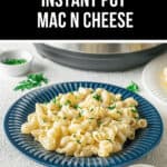 A plate of creamy Instant Pot Mac n Cheese garnished with parsley, accompanied by a side of grated cheese, sits invitingly in front of an Instant Pot.