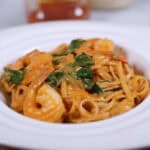 A plate with spinach and a blurred background.