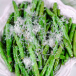 parmesan green beans on a white plate