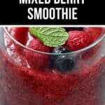 A glass of Mixed Berry Smoothie topped with whole raspberries, blueberries, and a mint leaf, with text reading "2 Ingredient Mixed Berry Smoothie.
