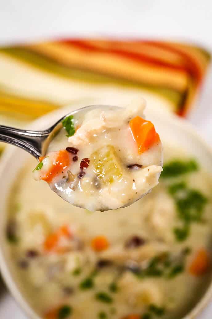 Slow Cooker Chicken and wild rice soup on a spoon