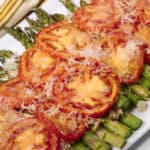 Easy asparagus recipe on a white platter with a striped napkin