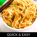 A bowl of spicy cold sesame noodles garnished with chopped green onions, accompanied by a pair of chopsticks resting on top. Text at the bottom reads, "Quick & Easy Cold Sesame Noodles.