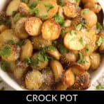Savor a bowl of crock pot red potatoes, perfectly roasted and garnished with fragrant rosemary for a delightful touch.
