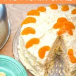 white cake with orange slices with blue plate