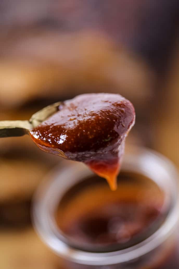 homemade barbecue sauce on a gold spoon