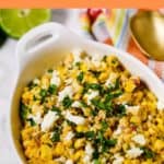 Mexican Corn Salad in white bowl with lime