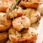 A platter of the side dish garnished with fresh thyme.
