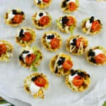 A tray of loaded taco bites on a table.
