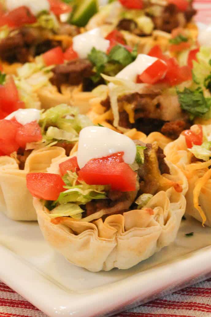 Beef taco tarts on a white plate