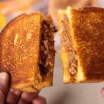 A person holding the dish in their hands.