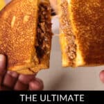 Close-up of a Sloppy Joe Grilled Cheese sandwich, being pulled apart to reveal gooey melted cheese and savory meat. Text at bottom reads: "The Ultimate Sloppy Joe Grilled Cheese.