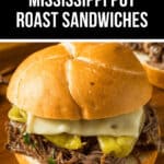 Enjoy a mouthwatering Mississippi Pot Roast sandwich, featuring tender beef, melted cheese, and tangy peppers, all nestled perfectly on a soft bun.