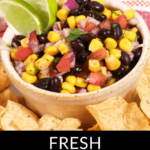 A bowl of black bean and corn salsa garnished with lime wedges, surrounded by tortilla chips, with the text "Black Bean and Corn Salsa" above.
