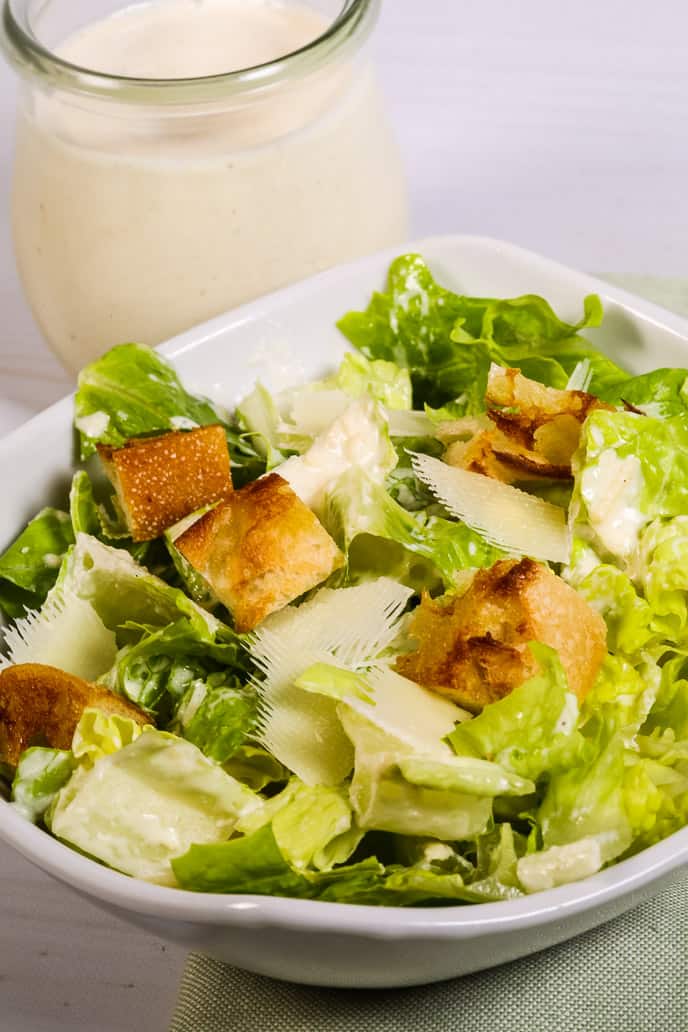 Closeup of Caesar salad ingredients in a bowl.
