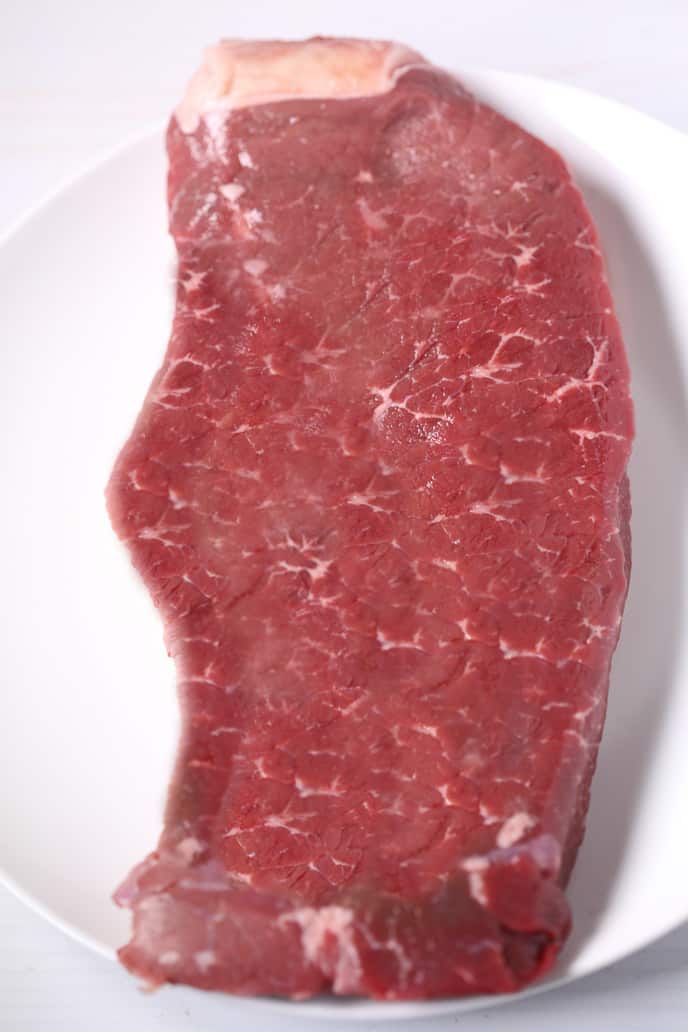 Close up of raw london broil steak.
