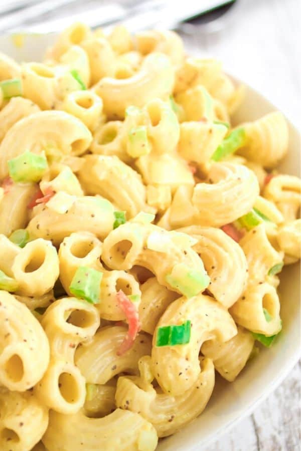 Classic macaroni salad with flecks of vegetables