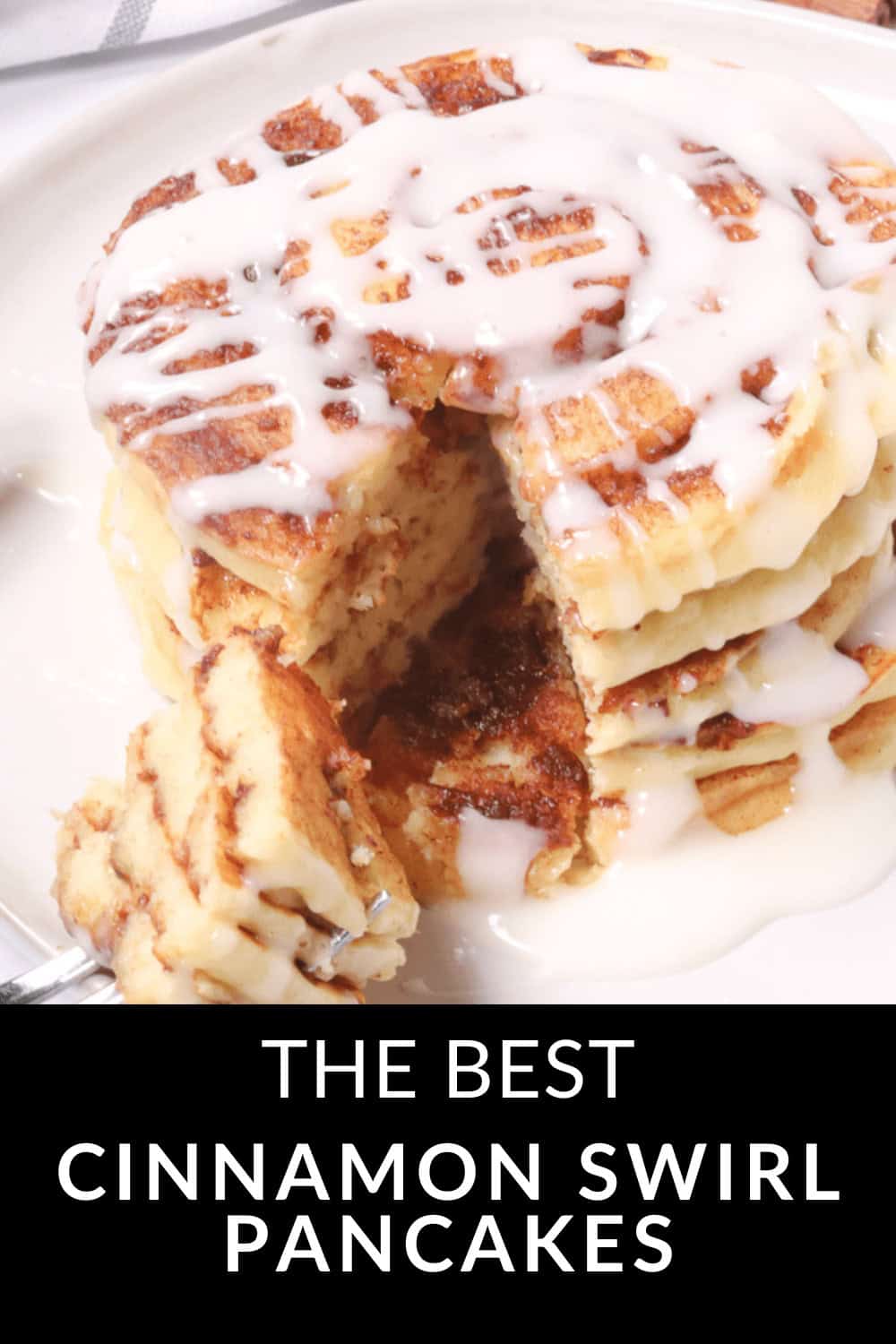 A tempting stack of cinnamon swirl pancakes with a drizzle of icing, partially sliced, sits invitingly on a plate with text: "The Best Cinnamon Swirl Pancakes.