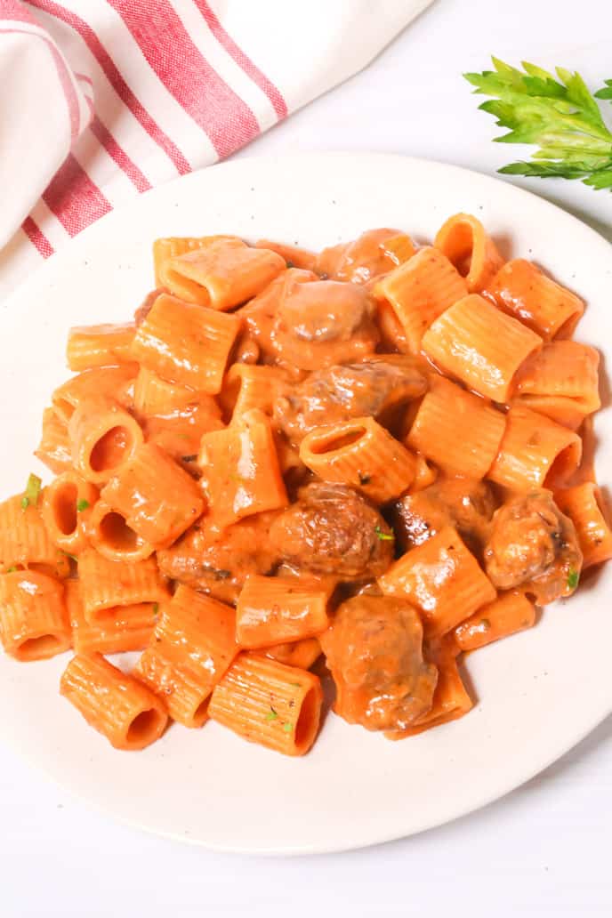White plate with Italian Sausage pasta recipes