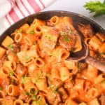 Pan of Italian Sausage Pasta with red and white napkin