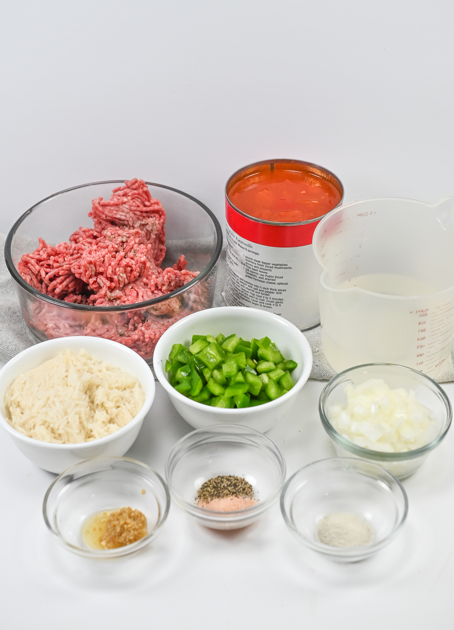 The ingredients laid out on a white surface for Unstuffed Pepper Soup.