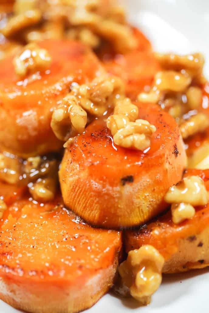 melting baked sweet potato recipe with walnuts sprinkled on top
