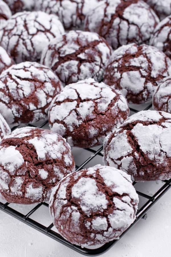 Chocolate crinkle cookies on a cooling rack