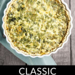 A freshly baked ham and cheese spinach quiche, served on a wooden surface.