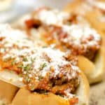 Close up on Instant Pot Meatball Subs with parmesan cheese on top