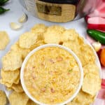 Photo looking down at Instant pot queso with meat and chips