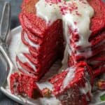 Stack of Red Velvet pancaes with a large bite taken out