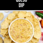 A bowl of creamy Crock Pot queso dip is surrounded by crispy tortilla chips, all set on a charming checkered red and white cloth.