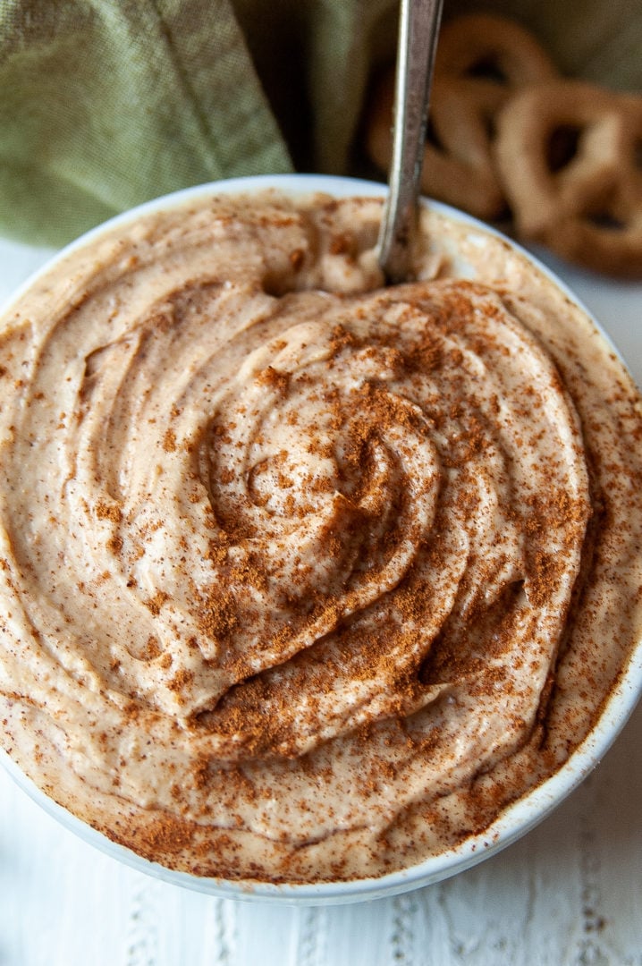 Top shot of the peanut butter yogurt dip in a white bowl.