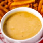 Chick Fil A Sauce close up in a basket with waffle fries