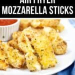 A plate of homemade Air Fryer Mozzarella sticks is served with marinara sauce on a white plate.